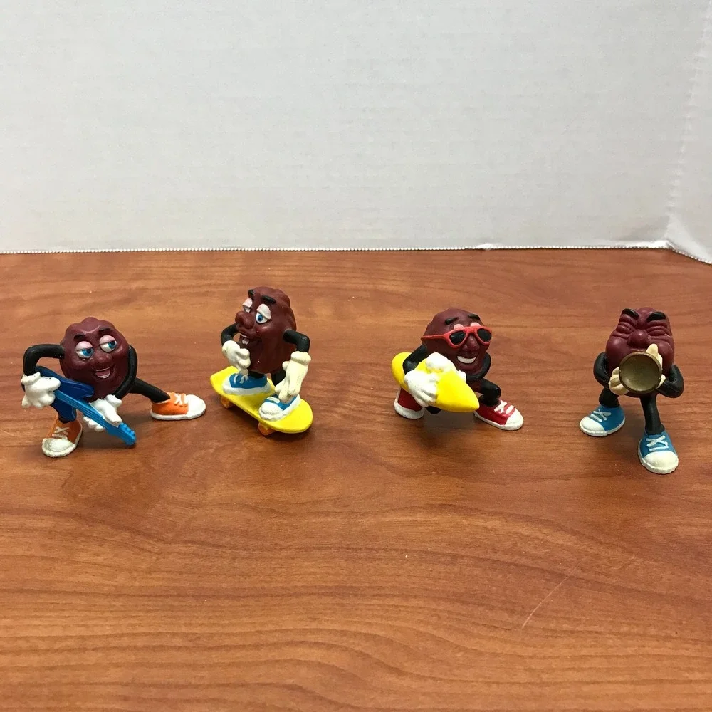 4 Vintage California Raisins figurines - Guitar - Skateboard - Surfer - Trumpet